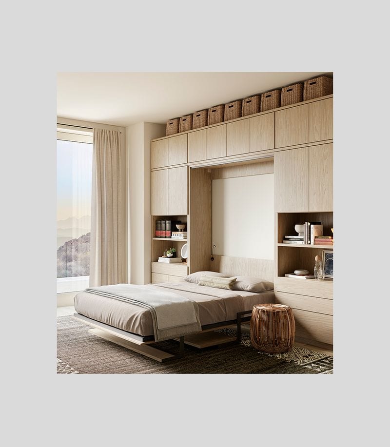 Opened Murphy bed with built in custom storage cabinets, drawers and desk by California Closets